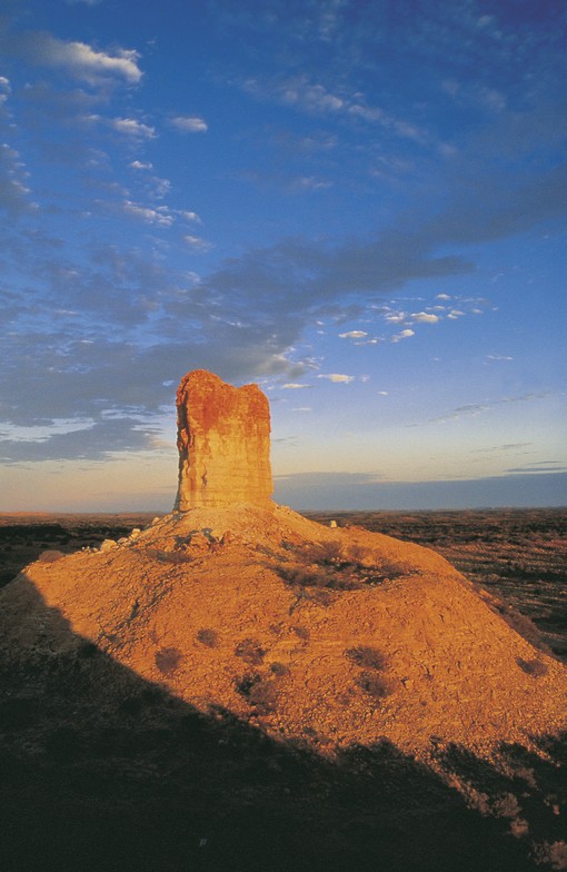 The 50m high sandstone pillar is the main feature of the Chambers Pillar Historical Reserve.